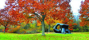 Large Two Forms statue by Henry Moore during autumn