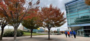 Community members take a walk on the plaza