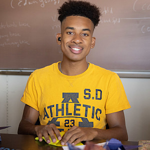 Student in yellow t-shirt.