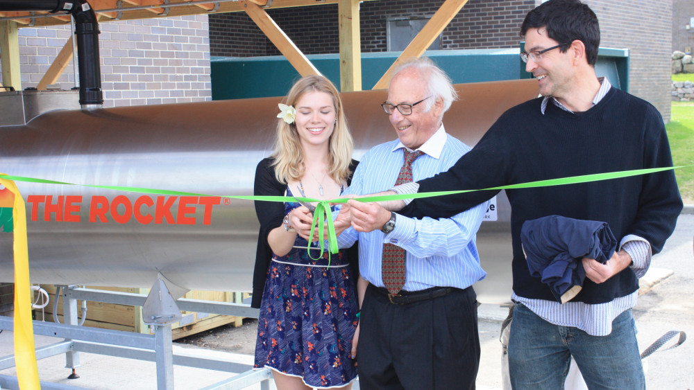 Thomas J. Schwarz cuts the ribbon opening the Rocket Launcher composter with Anna Palmer '15 and Associate Professor of Sociology Matthew...