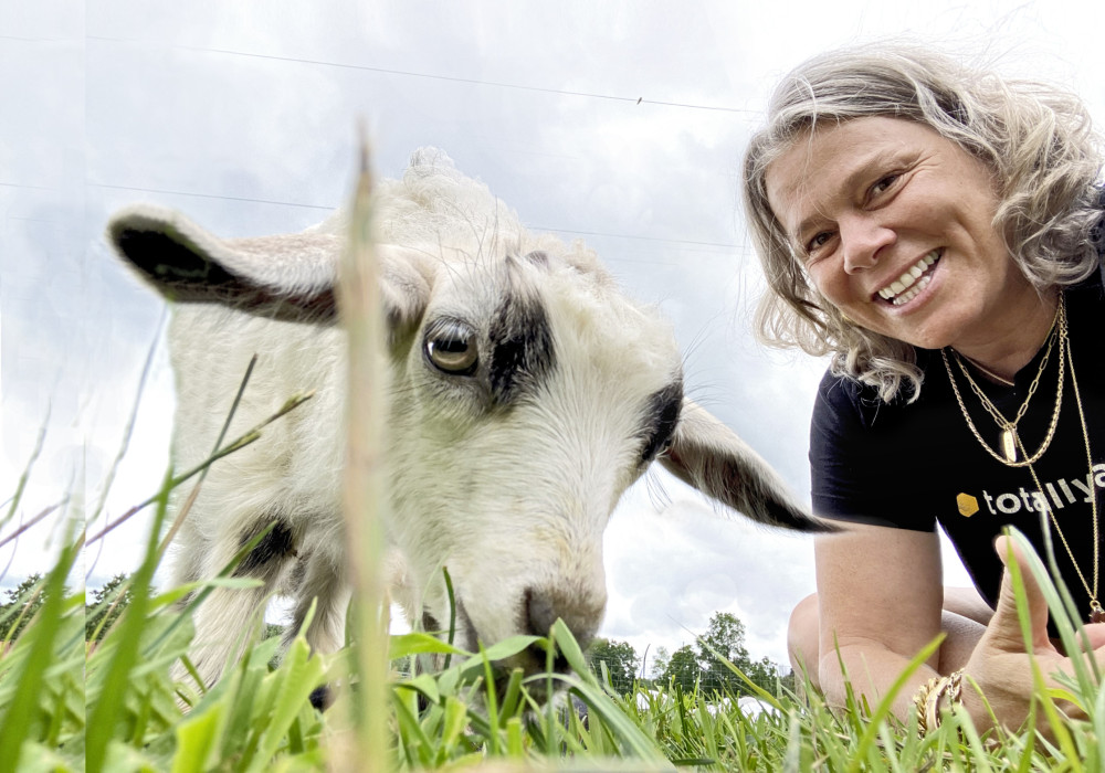 Distinguished Professor of Sociology and Gender Studies Lisa Jean Moore with a goat