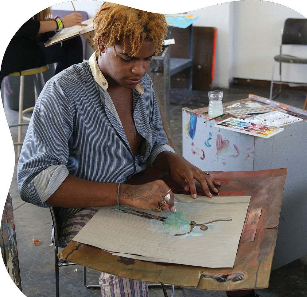 Student artist works on a drawing