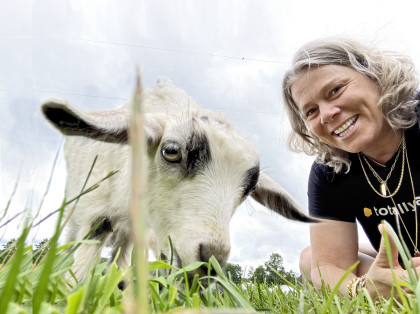 Distinguished Professor of Sociology and Gender Studies Lisa Jean Moore with a goat