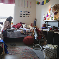 A student in their dorm room