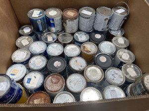 Large box holding several paint cans