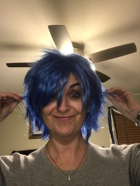 Bea wearing a blue wig.