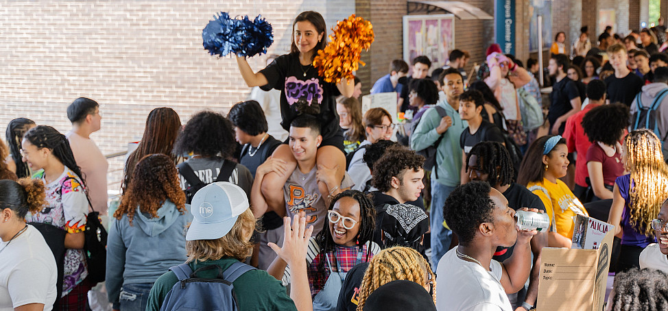 Students gathered on a walkway.