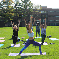 Students doing yoga on the Great Lawn