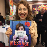 Regina Spektor '01 holds a copy of The Purchase Beat