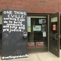 Multicultural Center invites passers by to comment on the one thing they can do to build community and help end prejudice.
