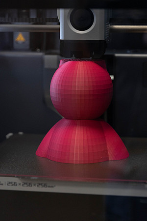 A 3D printer at work in the new Interactive Media Lab.