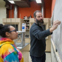 Student and faculty in science lab