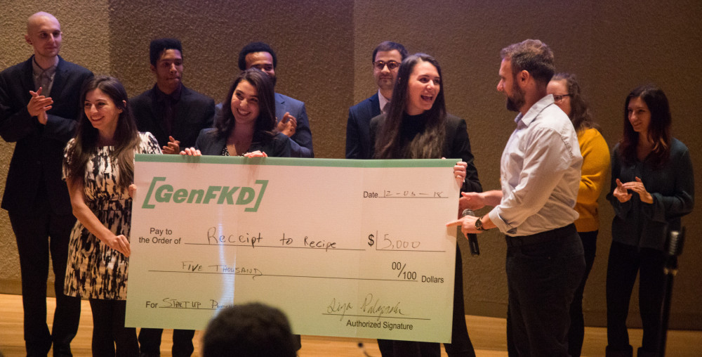 Seniors Angela Galli and Kelly Hayes receive oversized check for winning the second annual Start Up Purchase Pitching Competition