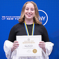 SaraRichter '24 Holds Award Certificate