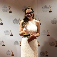 Rachel Weiss '16 holds her NYC Emmy