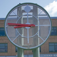 Interim President Dennis Craig and Chief Diversity Officer Jerima DeWese stand below the large clock on campus.