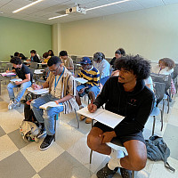 Students sitting at desks in a classroom.
