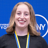 SUNY Chancellor John D. King, Sara Richter '24 holding award certificate, Purchase President Milagros Peña.
