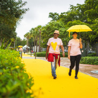 Participants walk on the The Yellow Walk performance created by Kate Gilmore