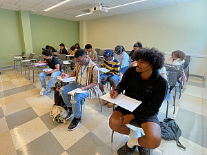 Students sitting at desks in a classroom.