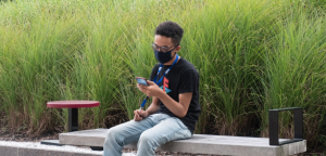 Student on campus viewing a cell phone