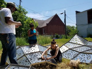 Students and collaborators work on American Riad project in Detroit