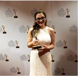 Rachel Weiss '16 holds her NY Emmy