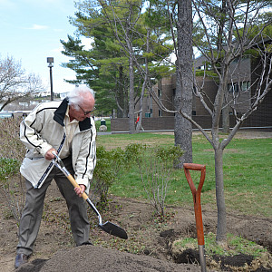 President Schwarz helps plant a tree for Clean and Green Day 2018