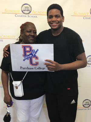 Quincy Phillips and his grandmother show their Purchase pride.