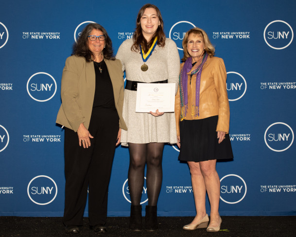 Corina Picon '22 with Purchase College President Milly Peña (left) and SUNY Interim Chancellor De...