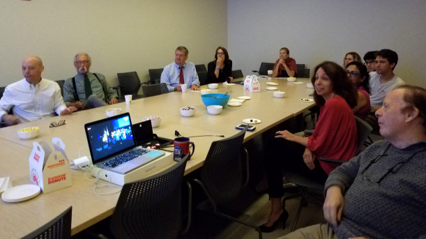 Domestico's colleagues in the School of Humanities gather for a viewing part of the Chancellor's Inauguration.