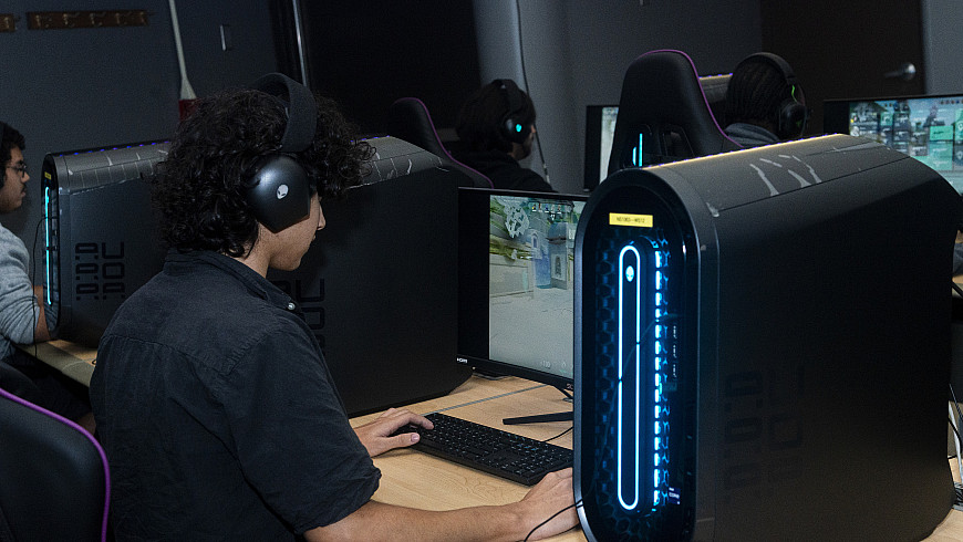Esports team members playing games in the Esports Arena