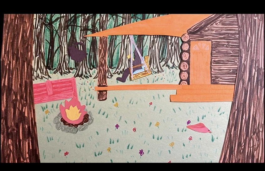a cabin and a campsite with a fire