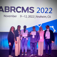 (Left) Ruth-Ann Gordon & Mauro David Cortina (right) hold their awards accompanied by the rest of our bridges students, Prof. Jonas a...