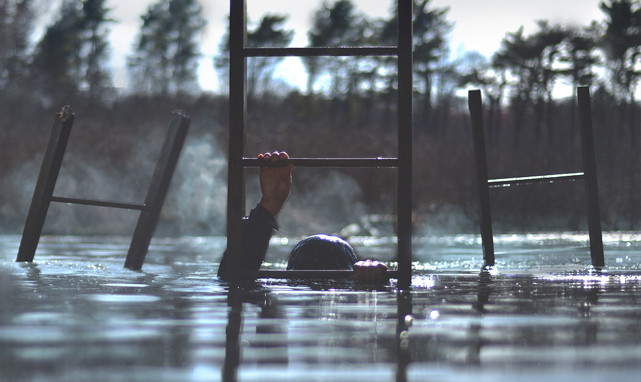 Photograph by Nicolas Bruno '15 (Person climbing a ladder out of a body of water)