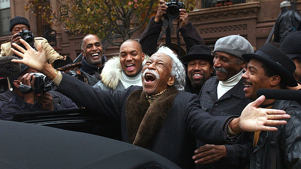 Gordon Parks at his 90th birthday celebration Gordon Parks laughing with photographers and friends at his 90th birthday celebration in Harlem