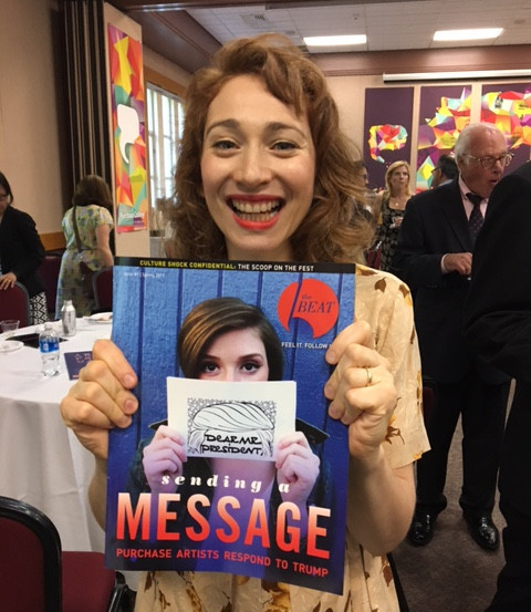Regina Spektor '01 holds an issue of The Purchase Beat (2017)