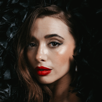 Emma Sofia close-up portrait on black background