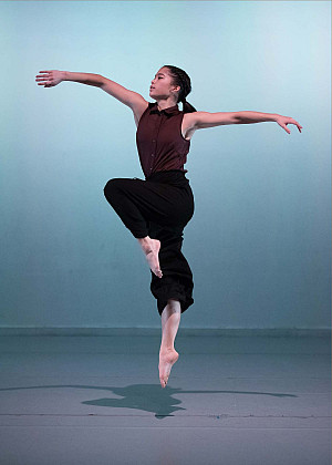 Kathryn Taylor joyfully jumping with open arms