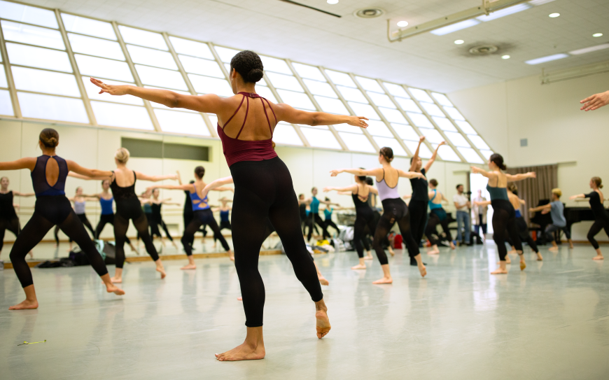 Student dancers in a light filled space