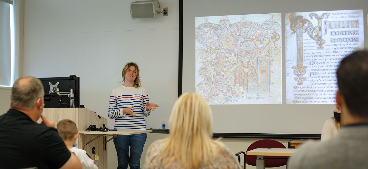 Student presents senior project during Humanities Symposium