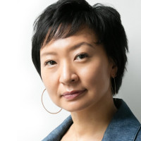 Headshot of Cathy Park Hong in blue blazer