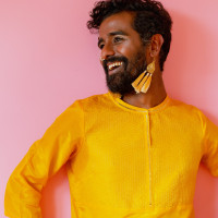 Kama La Mackerel in a yellow shirt.