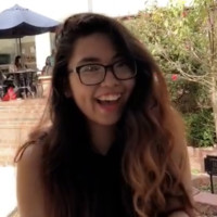 Student Angelica Pahamotang smiling wearing glasses