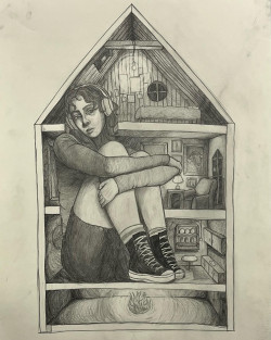 Girl with sneakers and headphones sitting in a dollhouse.
