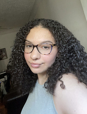 headshot of Emily Nugent wearing glasses