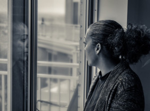 Poet and novelist Quan Barry looking out a window