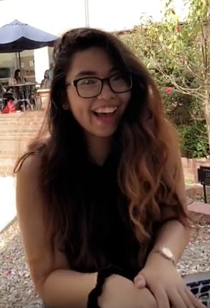 Student Angelica Pahamotang smiling wearing glasses