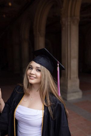 Student Kaitlyn Fikaris in Graduation cap and gown