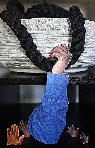 Hand grasping a rope.